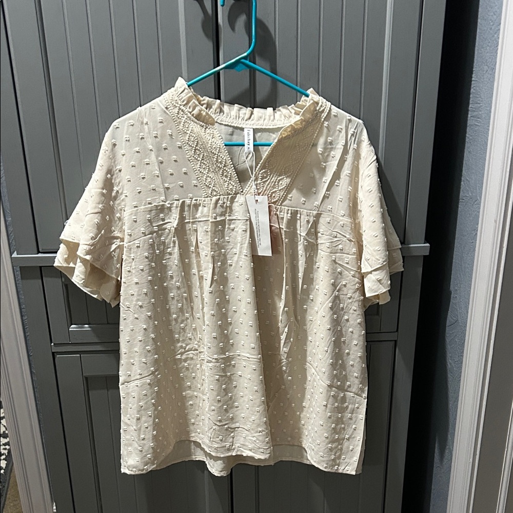 Elegant Cream Blouse with Textured Design